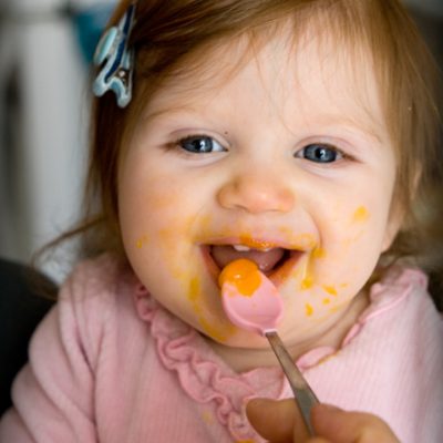 Mia eating egg yolk